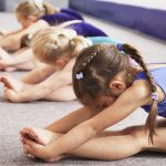 young gymnasts performing warming up routine